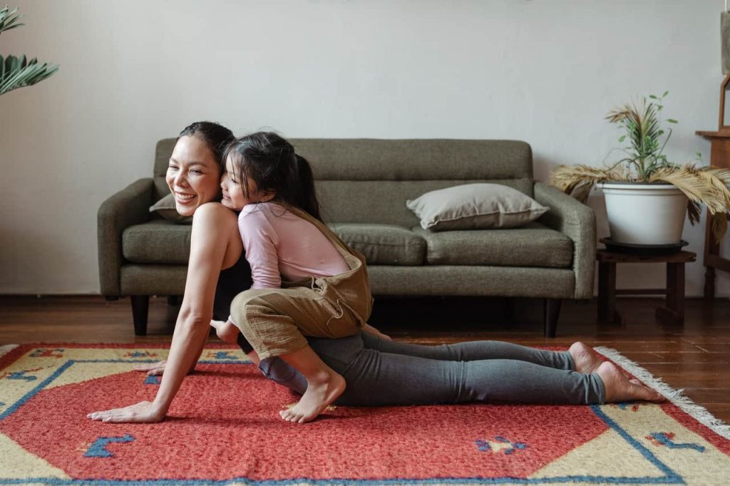 Picture of a mother and daughter doing yoga on Family Health and Fitness Day.