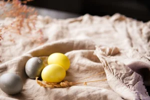 Easter eggs on a towel. Image is for the blog "Easter Activities for Preschoolers."