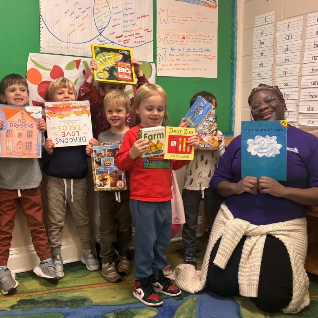 A Raleigh pre k program teacher reads books with students.