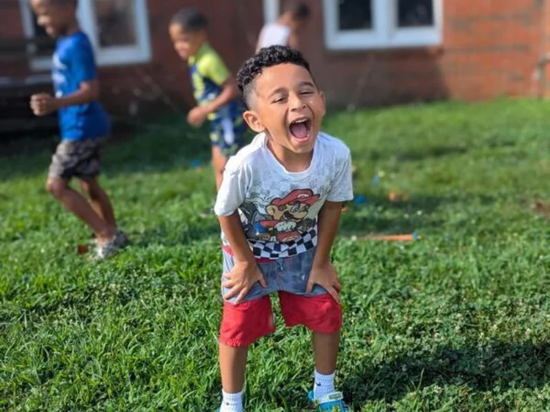 Male preschooler enjoying outdoor time. Raleigh preschool tour checklist