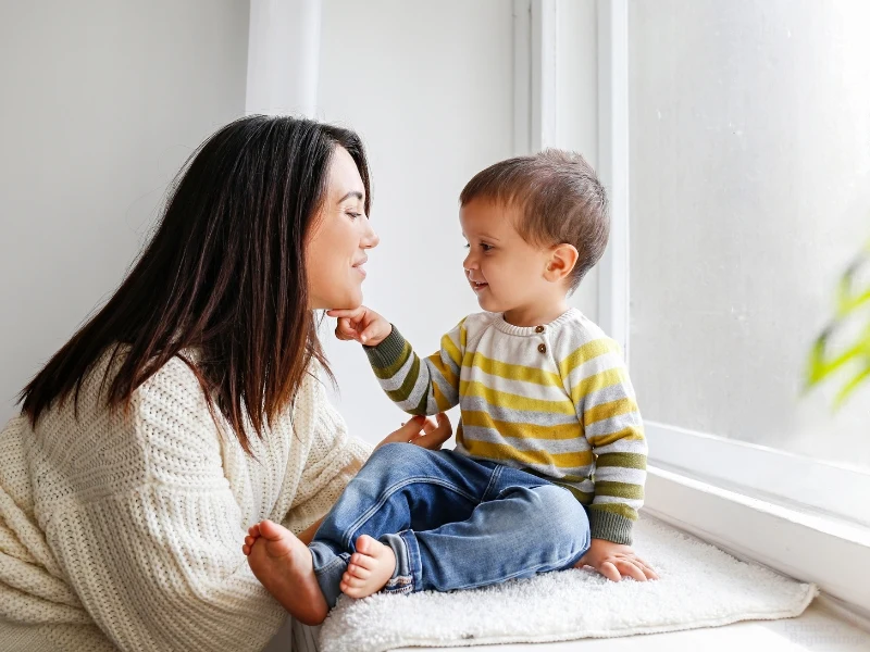 Mom talking to her toddler, exemplifying the back to school checklist for parents and kids. 