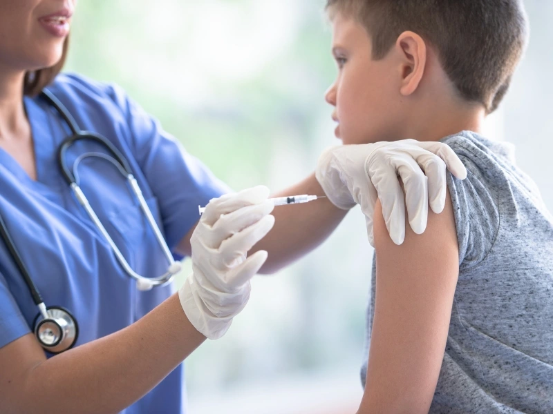Kid getting a vaccine as part of the back to school checklist for parents in NC. 