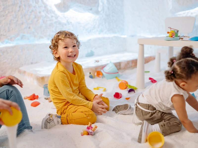 kids playing with toys, representing teaching how to encourage kids to share