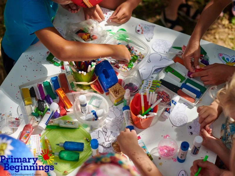 children work on creating infant mothers day crafts