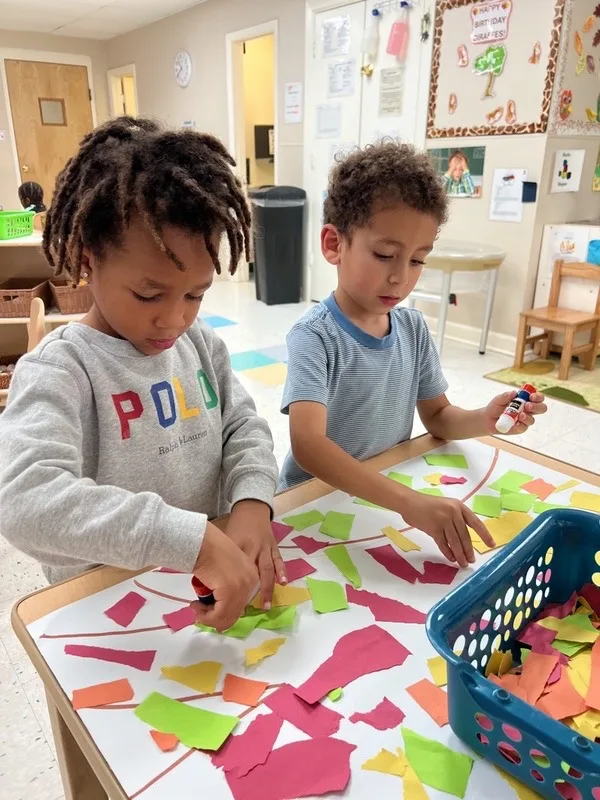 Two boys crafting, focusing on kindergarten readiness Raleigh NC