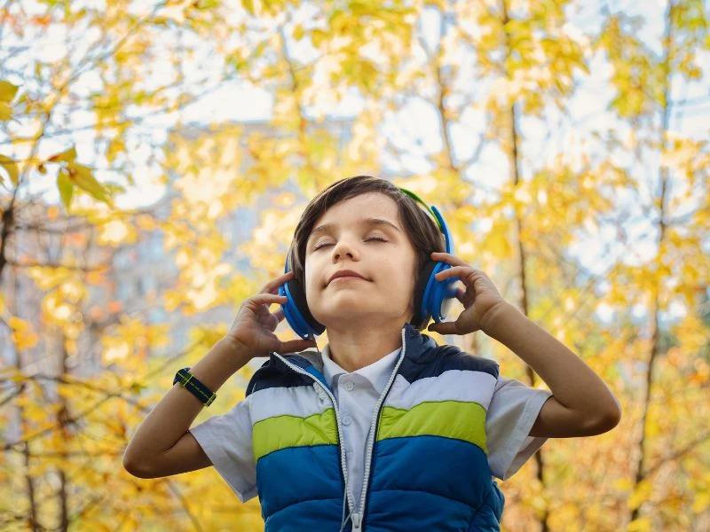 music benefits for children are increased happiness as shown by a child smiling