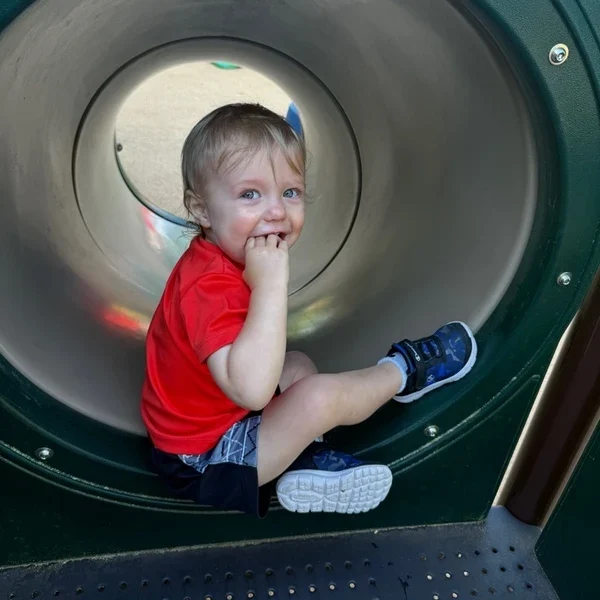 A young boy on a slide. This image is meant to accompany the page titled Toddler Care in Raleigh