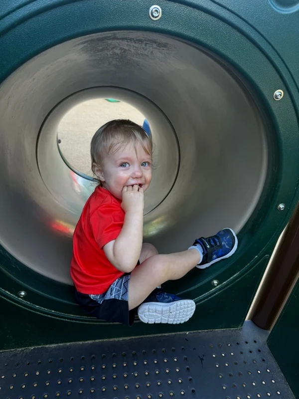 A young boy on a slide. This image is meant to accompany the page titled Toddler Care in Raleigh